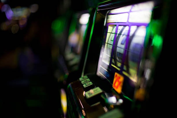 Live blackjack dealer at Evolution Gaming studio with multiple camera angles visible